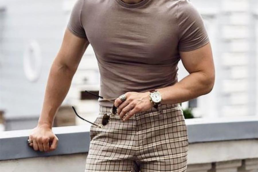 Man rocking coffee brown top and pattern-colored chinos pants
