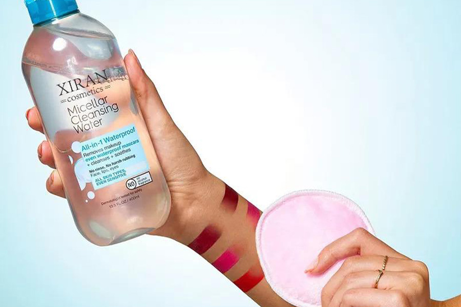 Person holding bottle of micellar cleansing water
