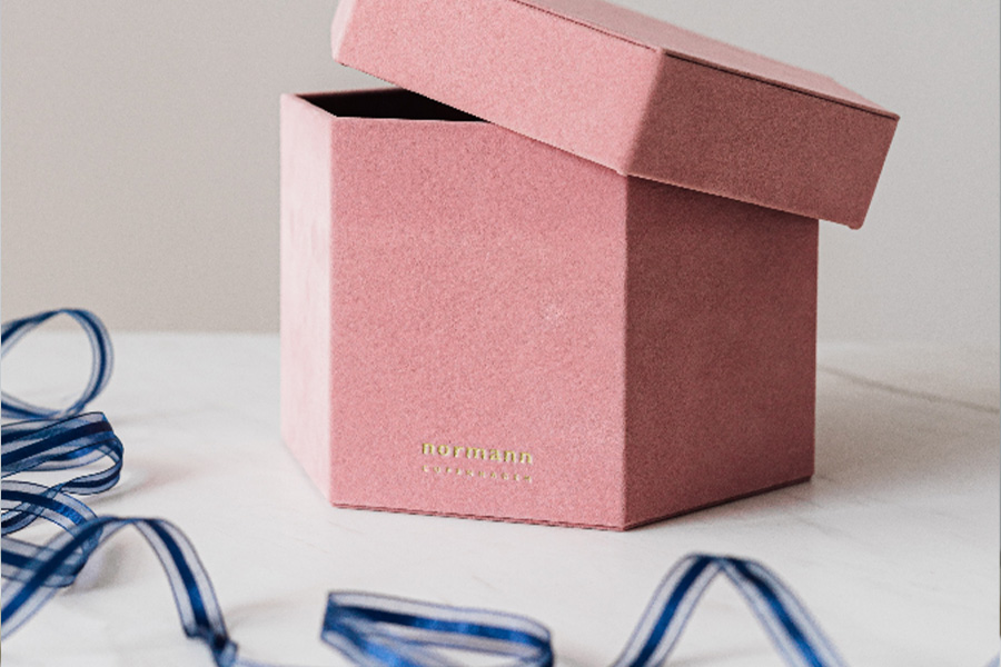 Pink hexagon hat box with blue ribbon