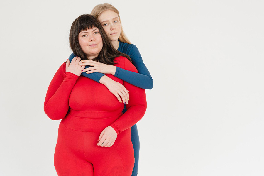 Plus-size woman in a fitted red jumpsuit