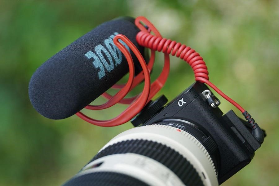 Shotgun microphone mounted on DSLR camera