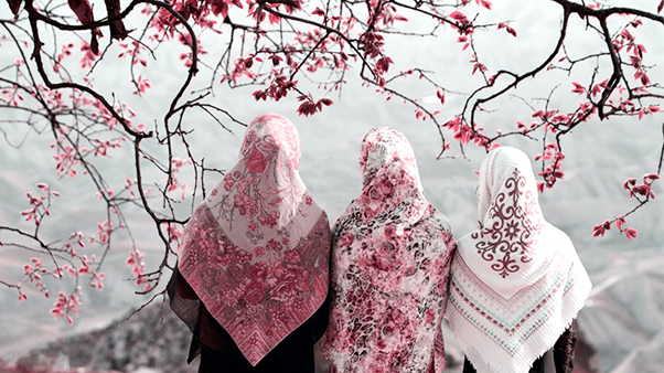Three Women Wearing Different Styles Of Printed And Colorful Hijabs