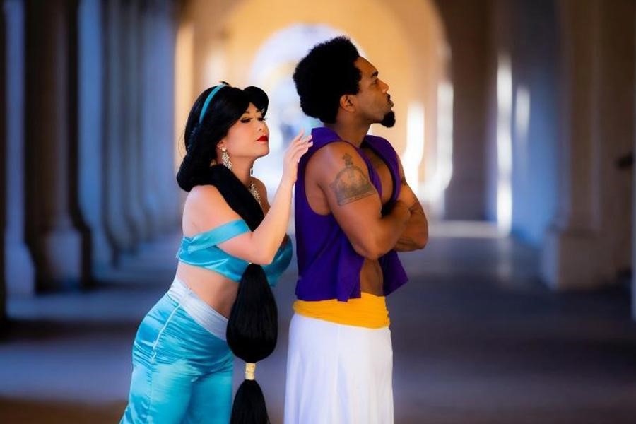 Woman and man in Princess Jasmine and Aladdin costumes
