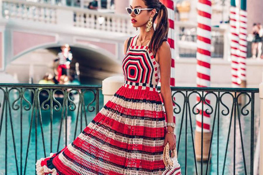 Woman In Red And White Stripe Crochet Dress