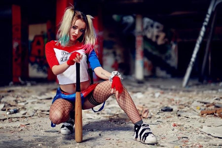 Woman in sexy Harley Quinn costume