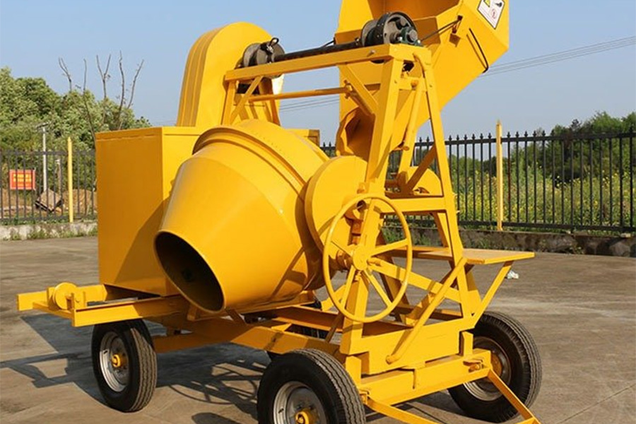 Yellow automatic concrete drum mixer