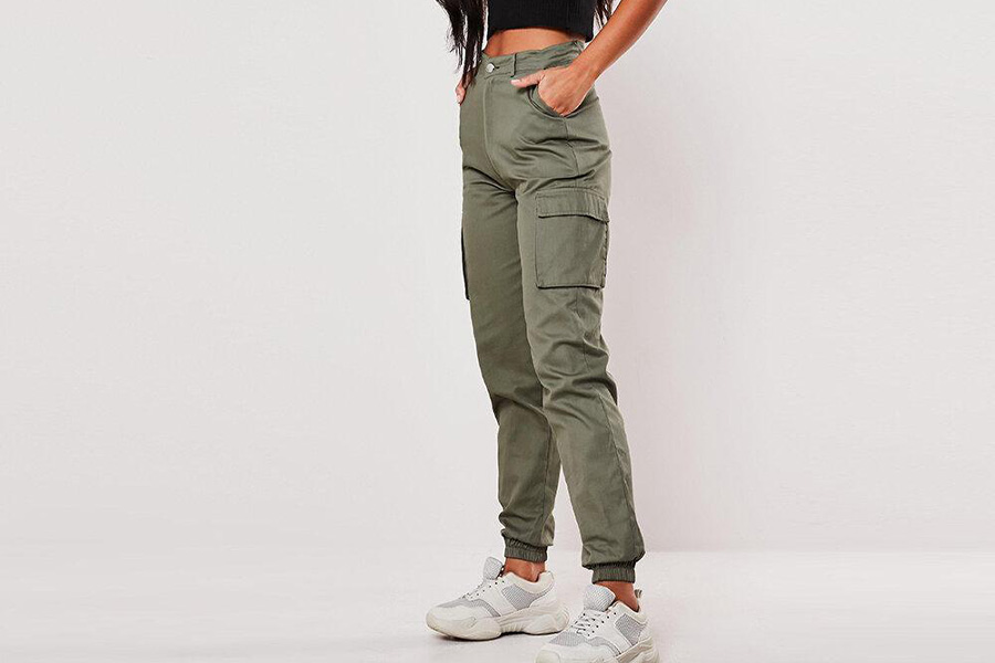 A lady rocking deep green cargo pants with elastic ankles