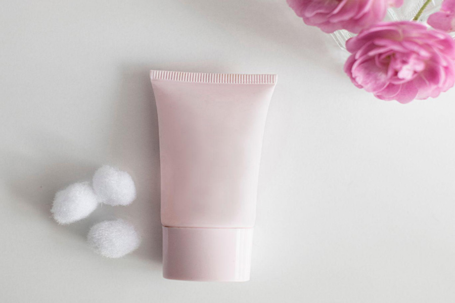 A pink color cosmetic tube made of recycled materials