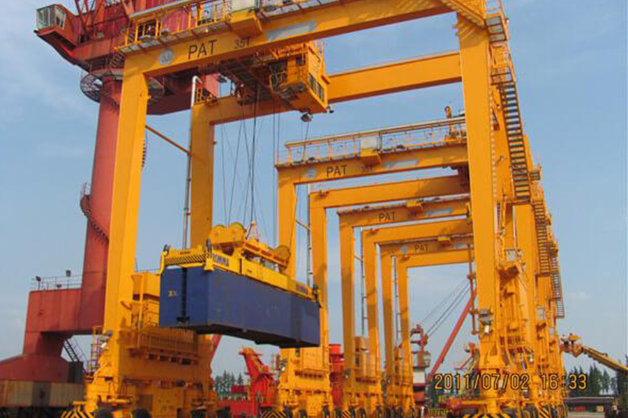 A rubber tire gantry crane in action at port