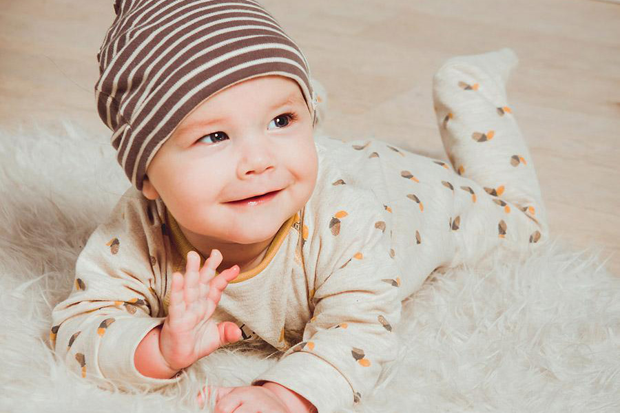 Baby rocking a rib knit set with hat