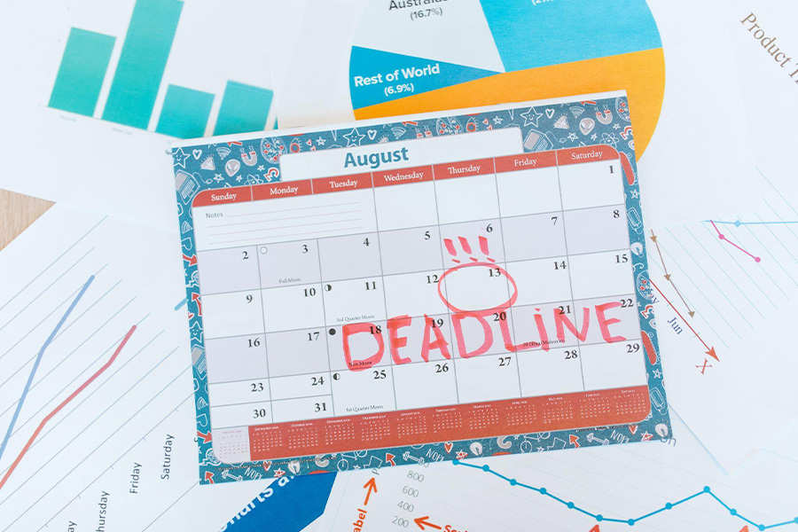 A blue to-do calendar, showing a red deadline imprint on it.