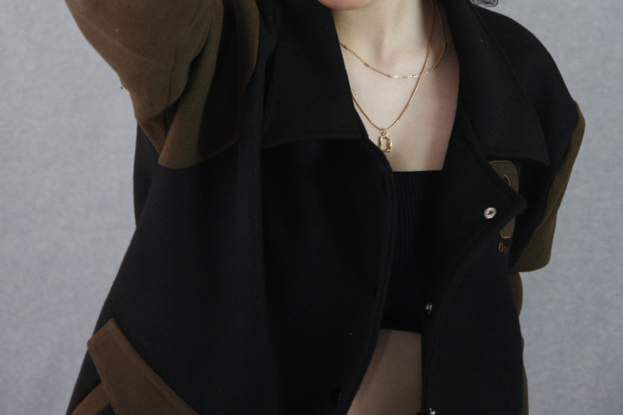 Brown and black bomber jacket with paneling
