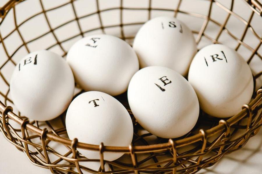Different white eggs in one basket