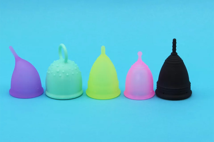 Image showcasing five menstrual cups in different colors
