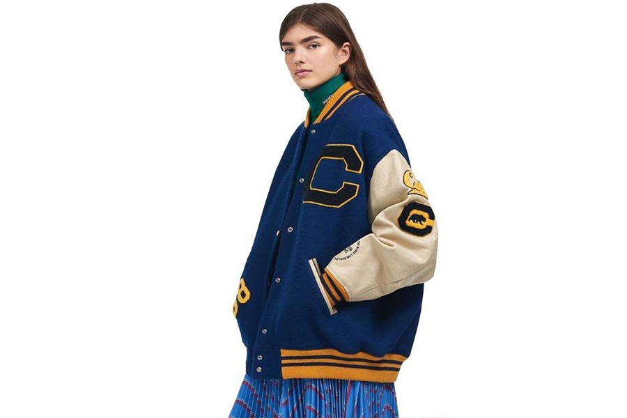 Lady in blue over-sized letterman jacket and skirt