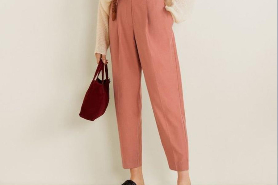 Lady in peach-colored baggy trousers