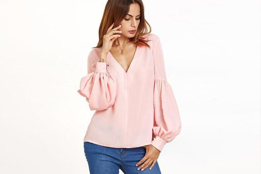 Lady posing in a sweet pink blouse