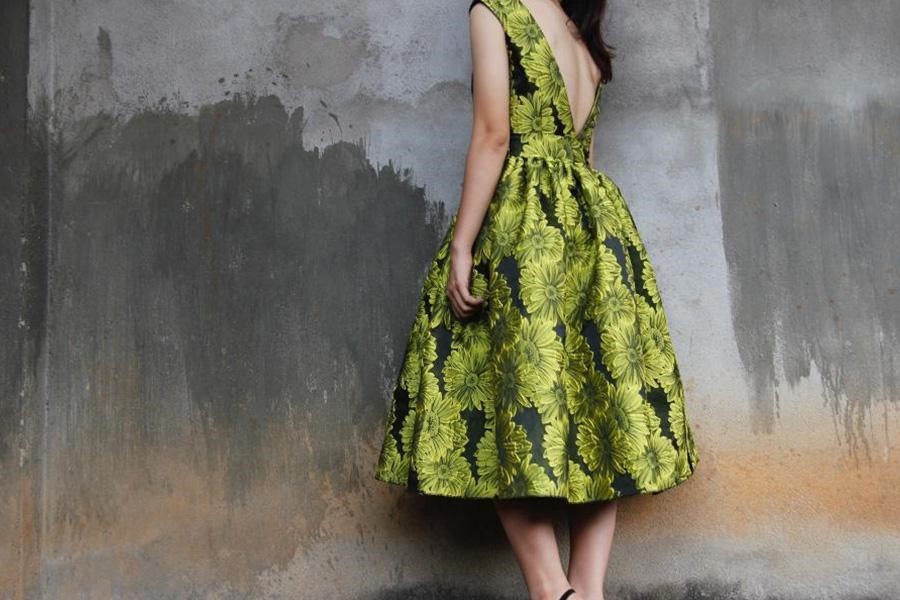 Lady wearing a green floral design dress