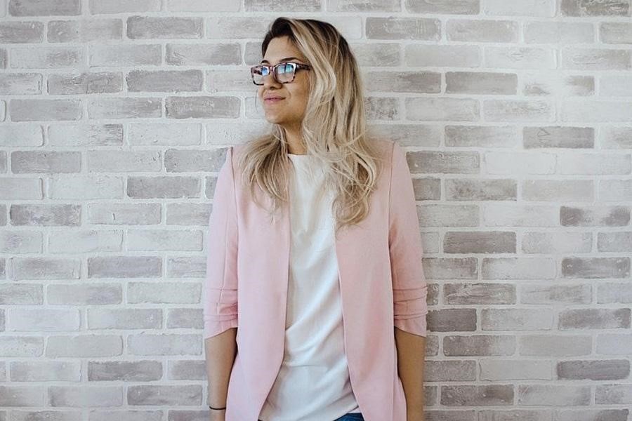 Lady wearing a pink business-casual blazer