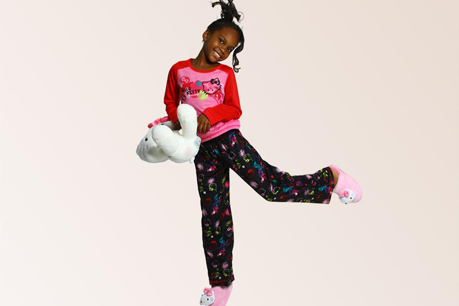 Little girl wearing a multicolored plush loungewear set