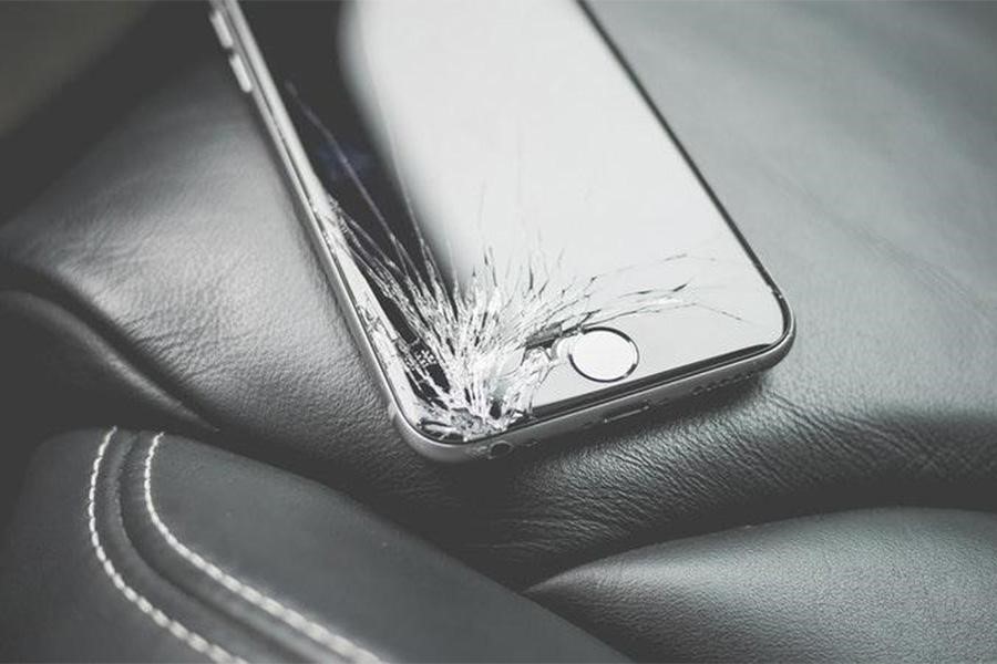 Smartphone with cracked screen in black and white