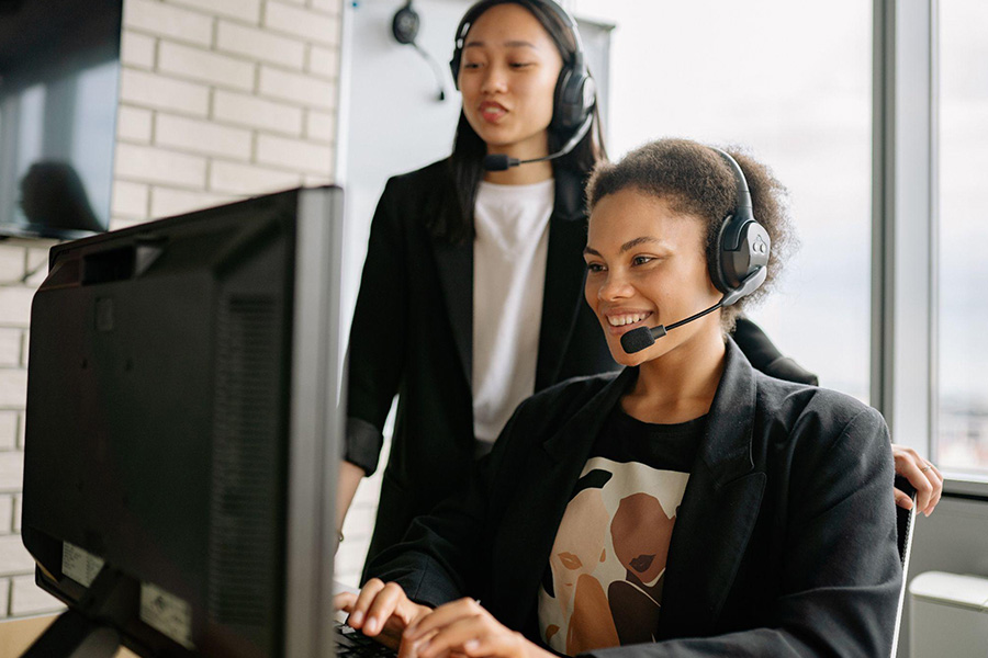 Smiling customer support staff at work