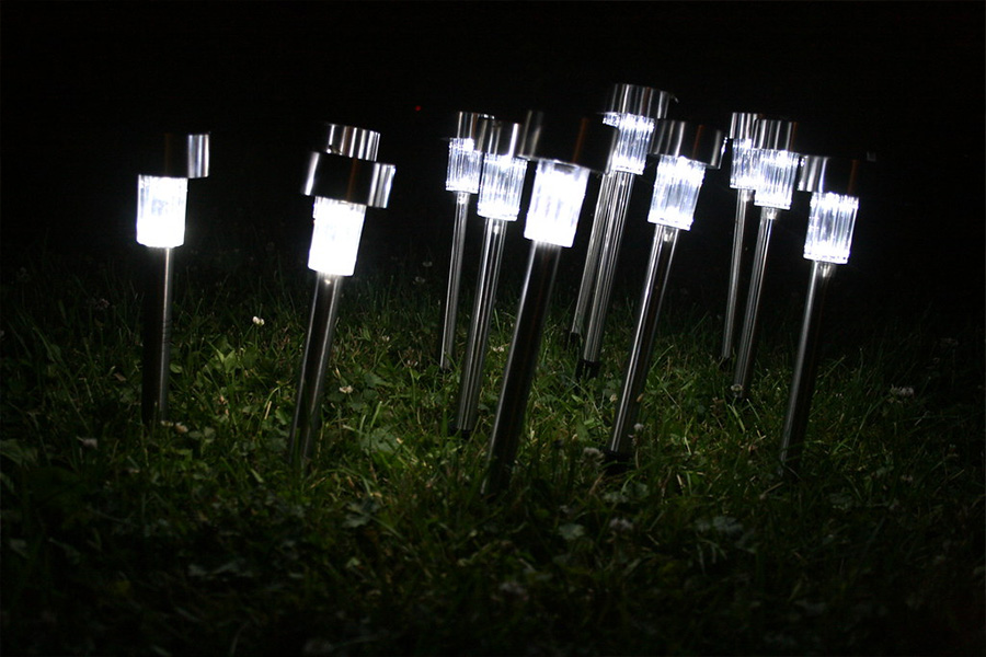 Solar-powered LED garden lights shining at night