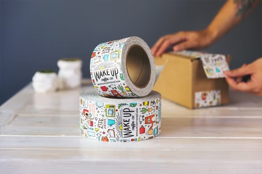 Tape with colorful pattern being used for shipping box