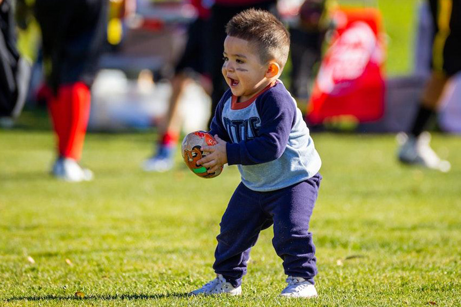 Toddler wearing a navy blue and gray sweat set