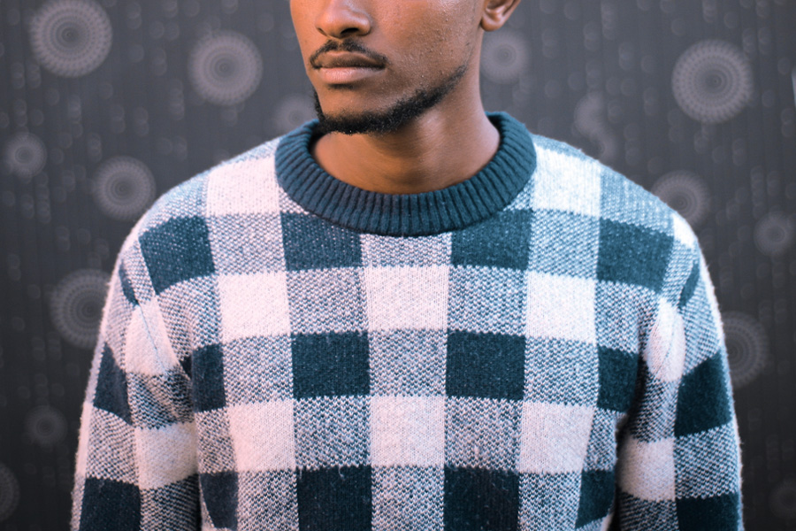 White and blue checkered men’s knit crew neck sweater