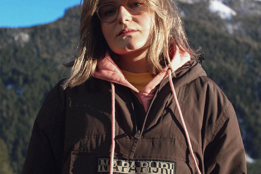 Woman hiking in a brown fleece jacket