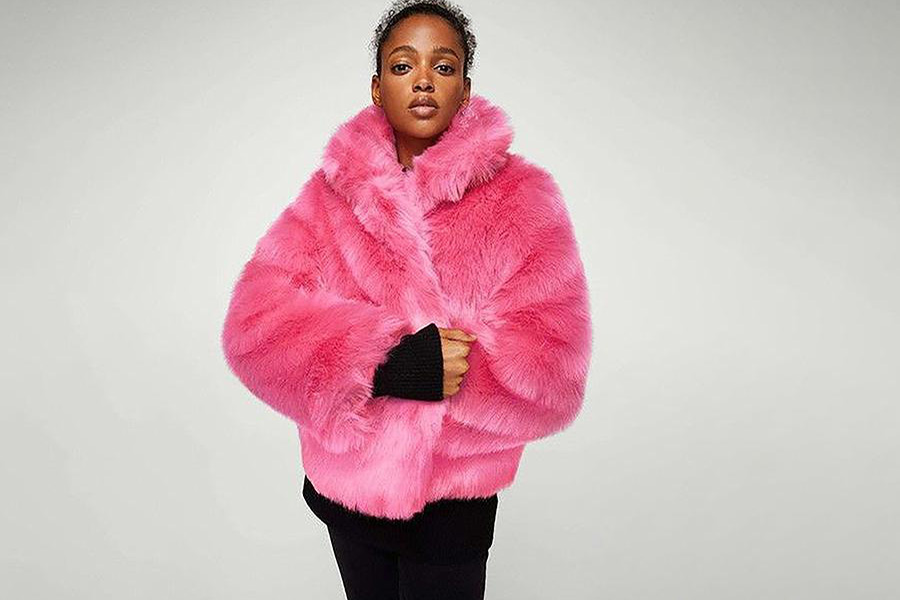 A woman rocking a pink fur coat