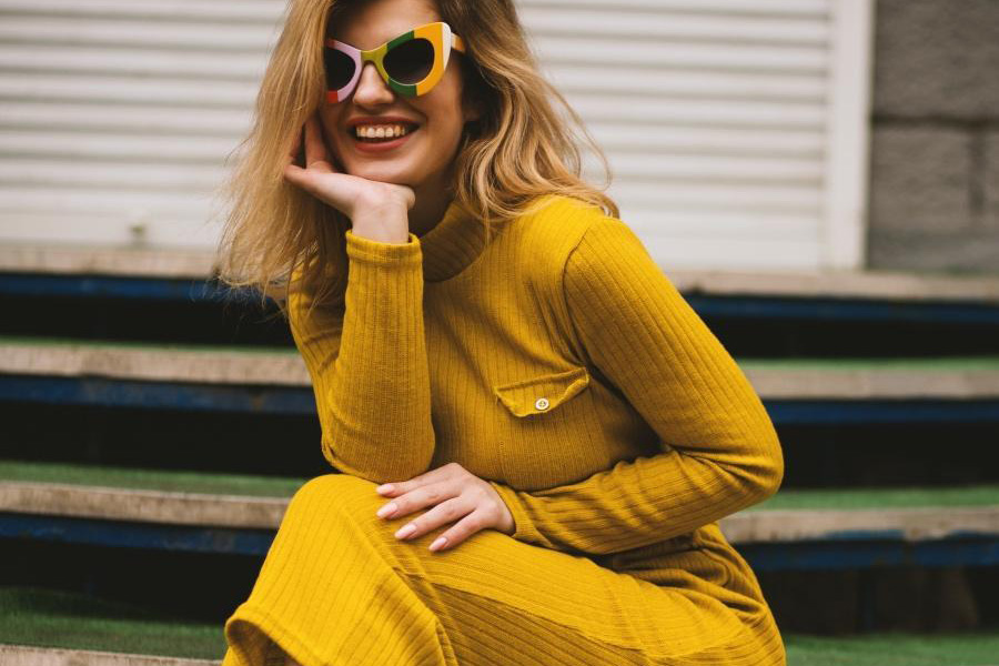 Woman wearing a bright yellow knitted dress