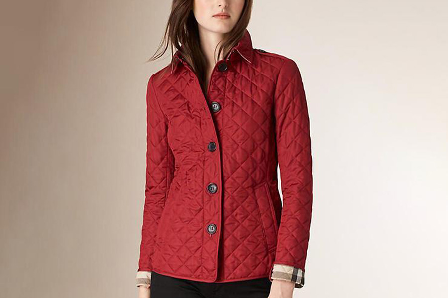 A woman wearing a red quilted jacket