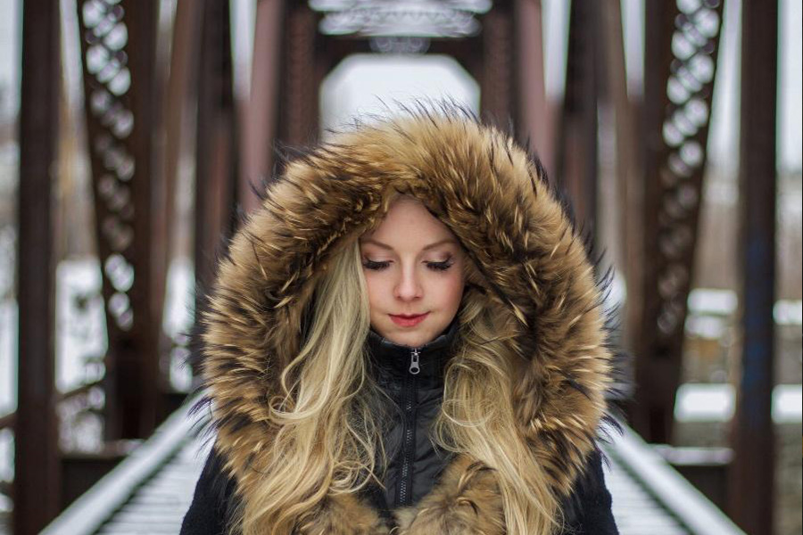 Woman wearing a shearling jacket with extra padding