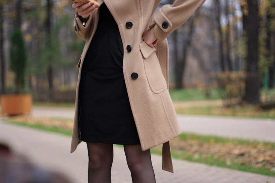 Woman wearing a tan wool trenchcoat