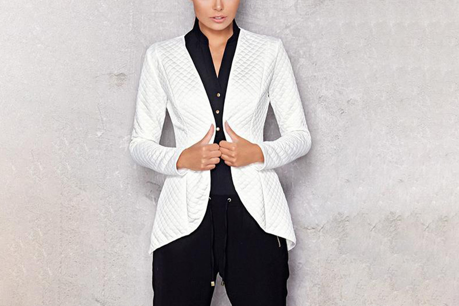 A woman wearing a white quilted coat