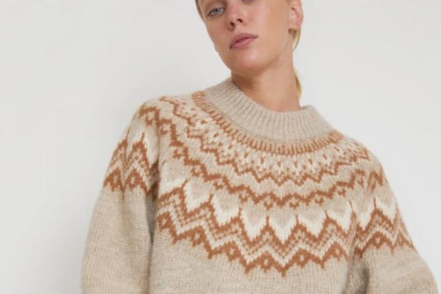 Woman wearing cream knitted Fair Isle sweater