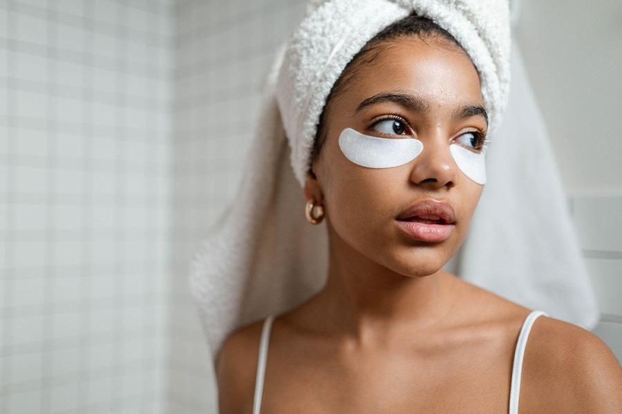Young woman wearing under-eye masks