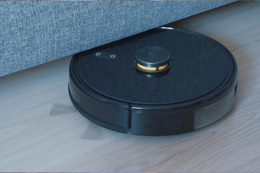 A black robotic vacuum cleaner