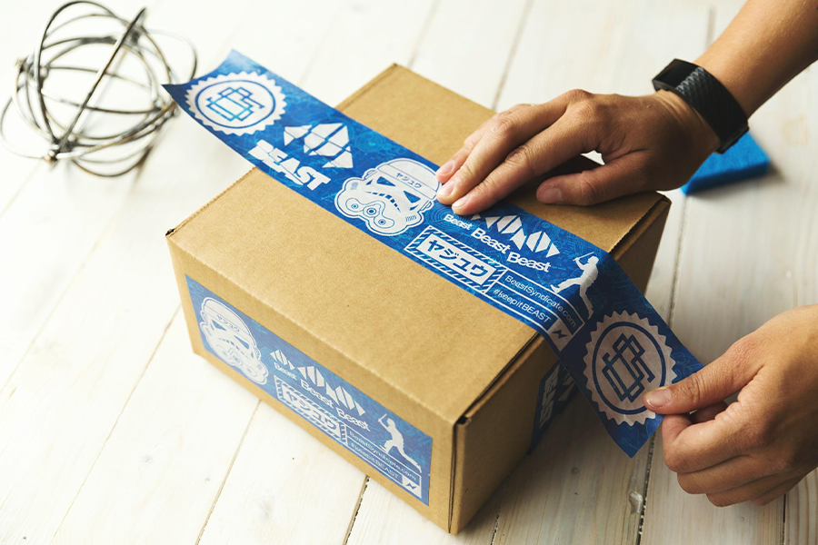 A delivery box being sealed 