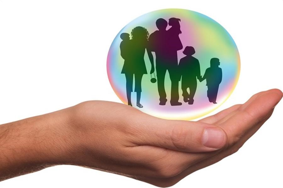 A family in a hand-held protective bubble