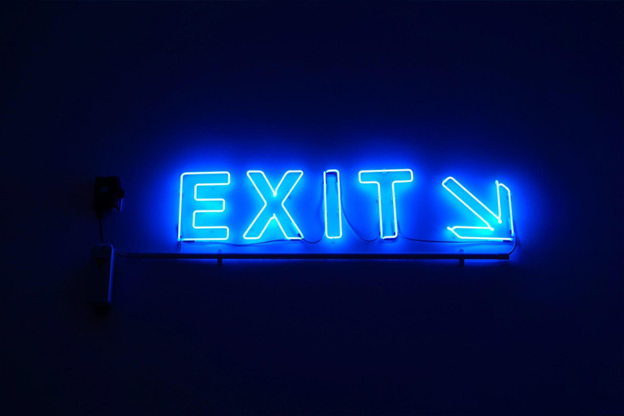 A neon sign that says exit