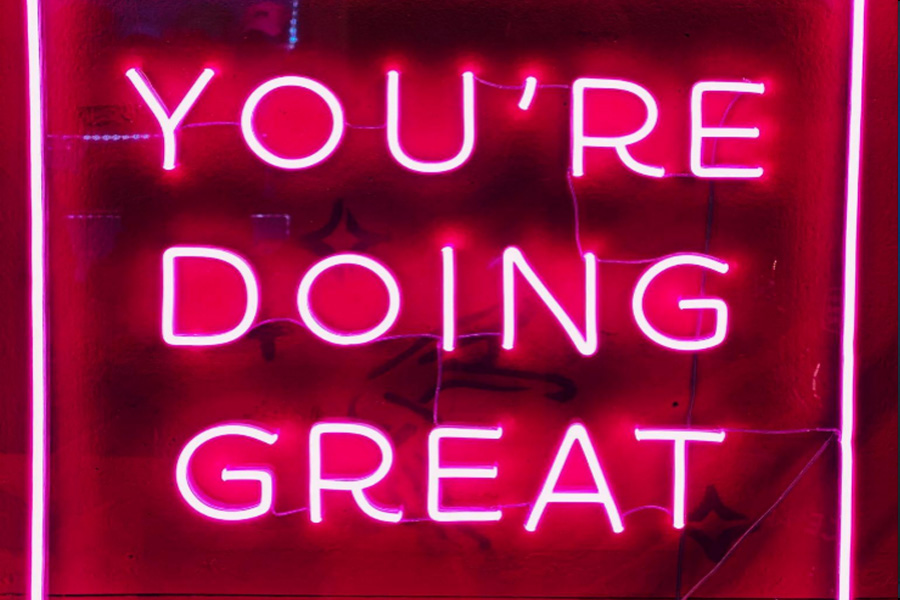 A neon sign that says ‘you’re doing great