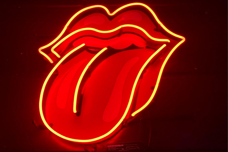 A red tongue out shaped LED neon sign