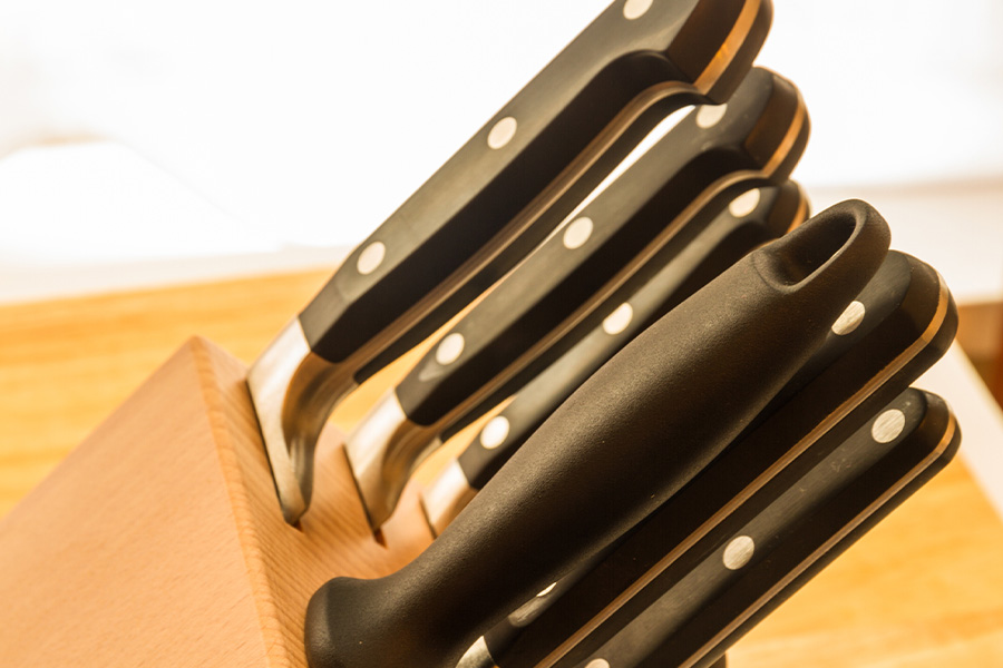 A set of kitchen knives on the chopping board