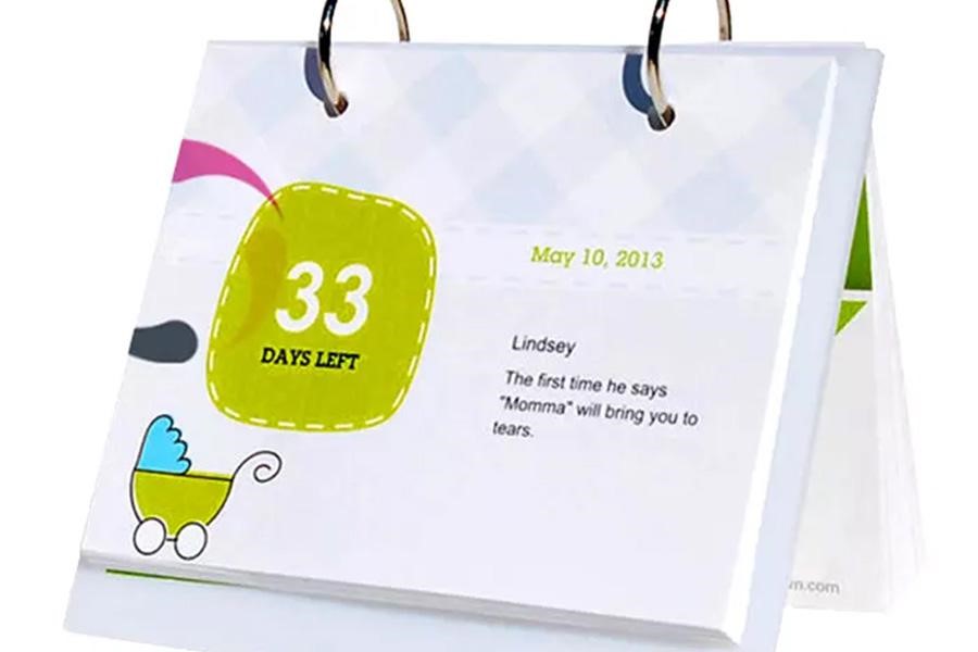 A small personalized printed calendar with birth countdown