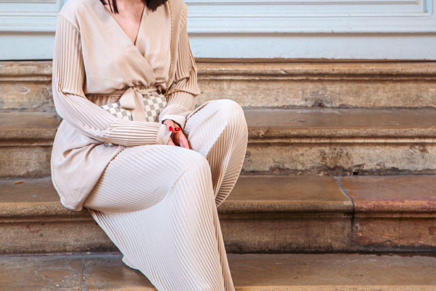 A woman wearing a beige color matching set