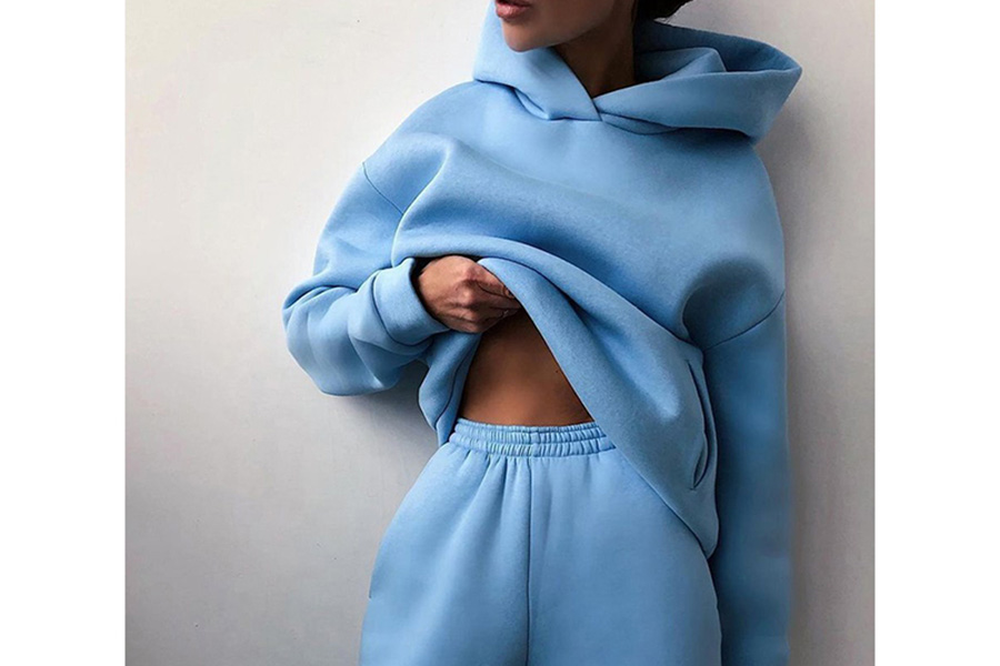 Blue two-piece set of sweat pants and hoodie