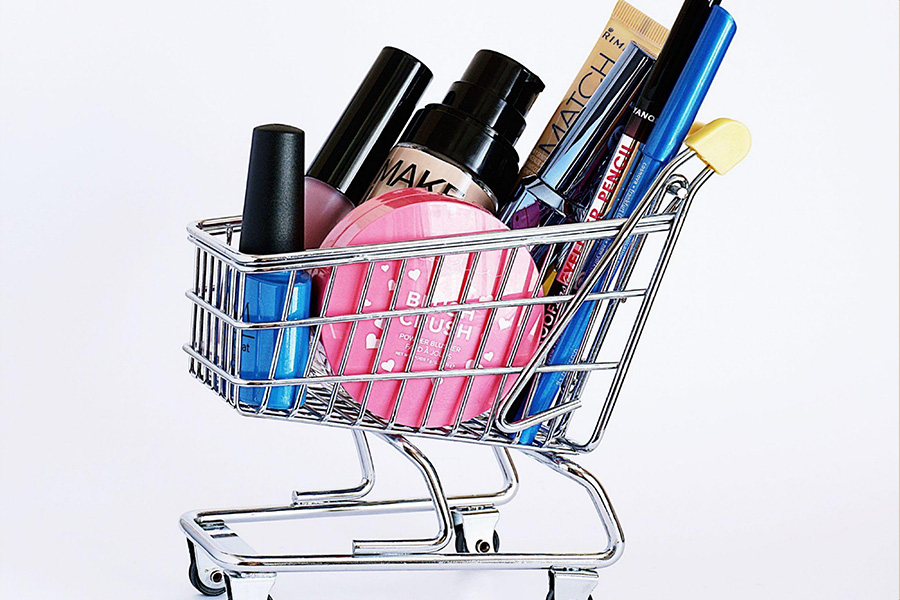 A collection of different cosmetics in a miniature trolley